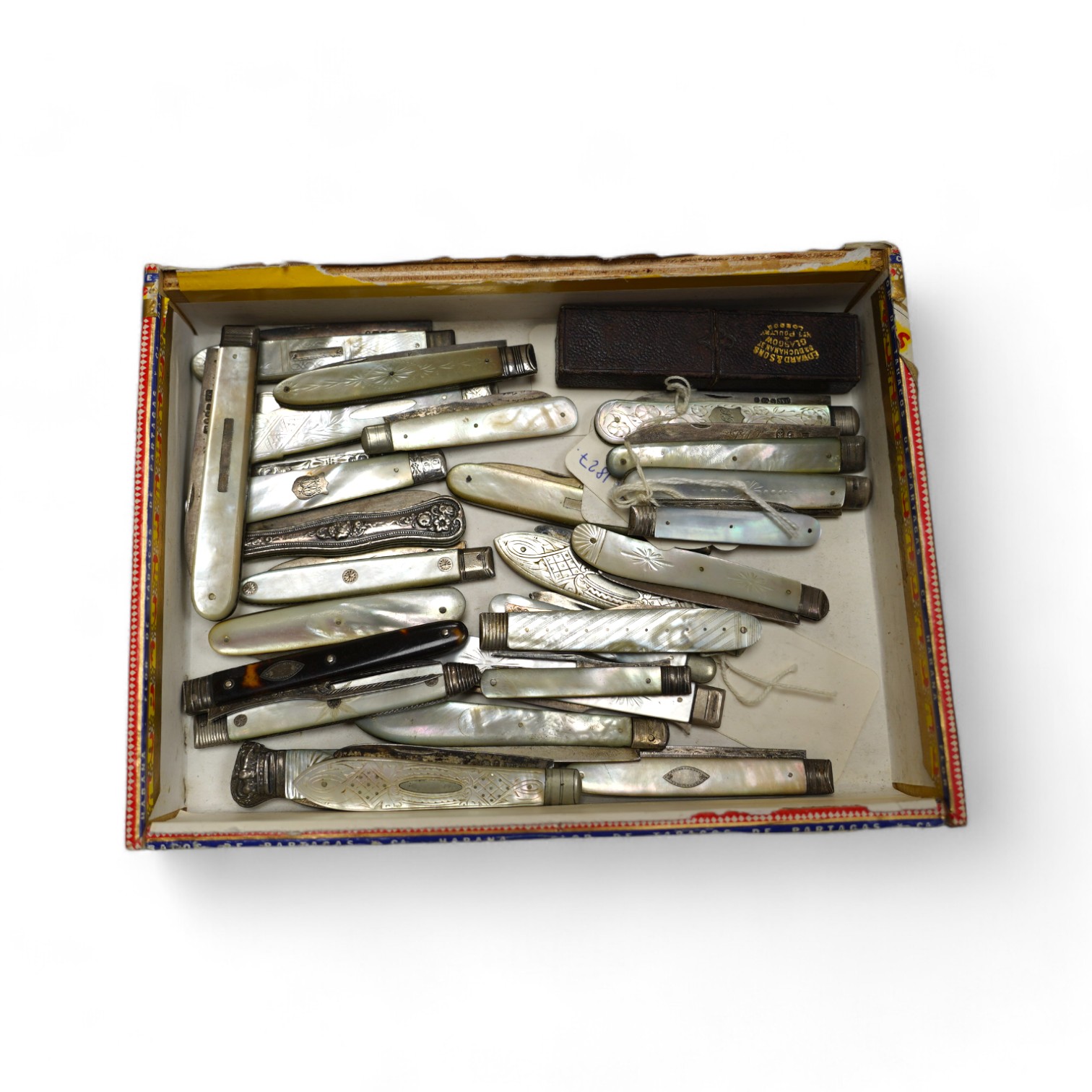 A collection of twenty two assorted mainly Victorian mother of handled silver fruit knives, one with leather case, together with a similar sterling knife and four Georgian silver travelling forks, three with mother of pe